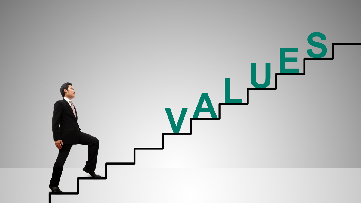 A man walking up stairs that have the word "Value" on the side. 